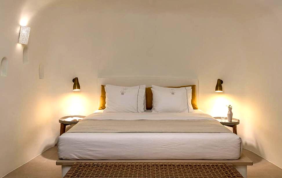 modern bedroom with arched ceiling and soft lighting